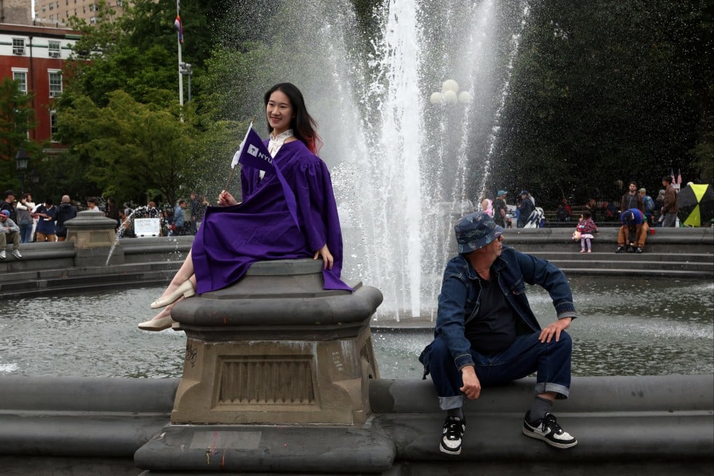 A Chinese university student poses for a graduation photo in New York City, on June 1. Photo: Reuters