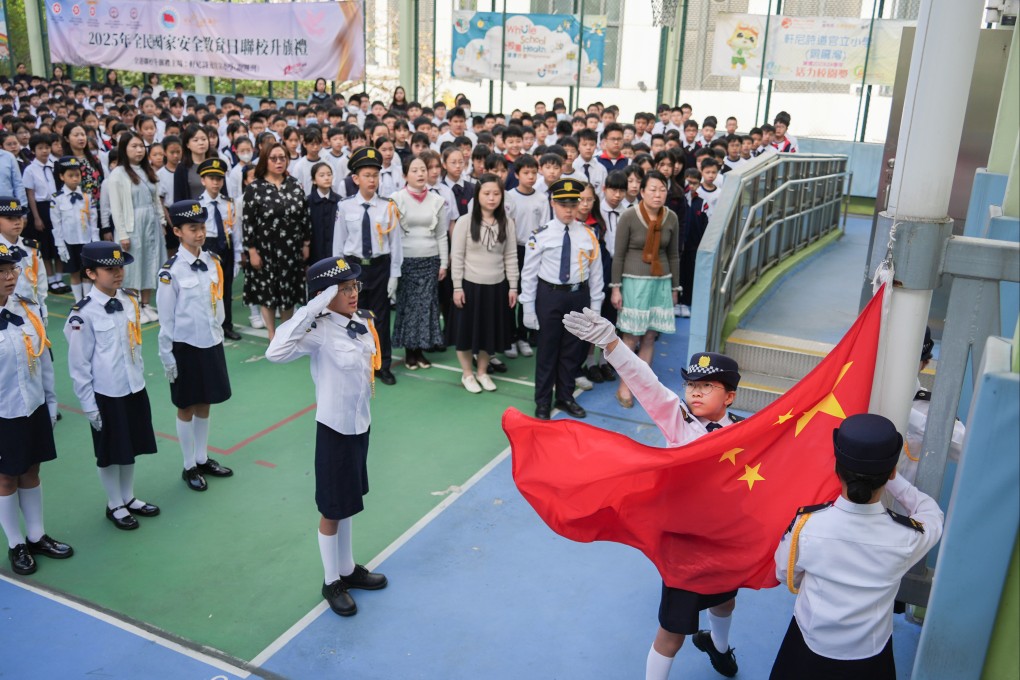 A flag raising ceremony at a primary school on National Security Education Day. Photo: Eugene Lee