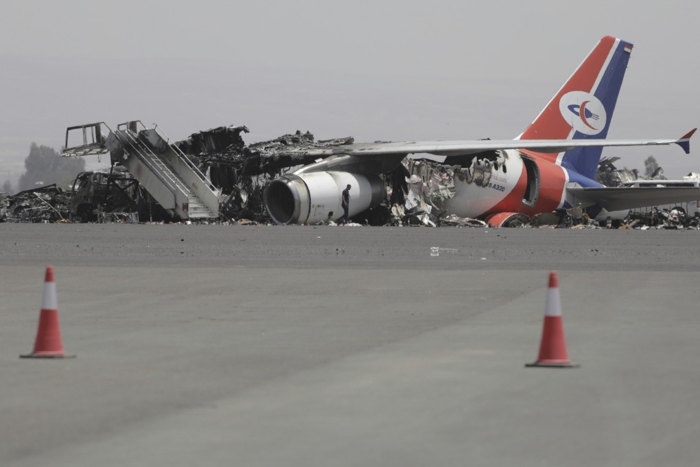 A damaged plane at Yemen’s Sanaa International Airport, a day after Israeli strikes in May. Photo: AP