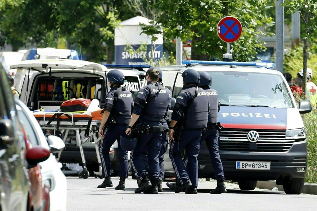 Policemen are seen in a street close to a school where, according to reports, several people died in a shooting, on Tuesday in Graz, Austria. Photo: AFP