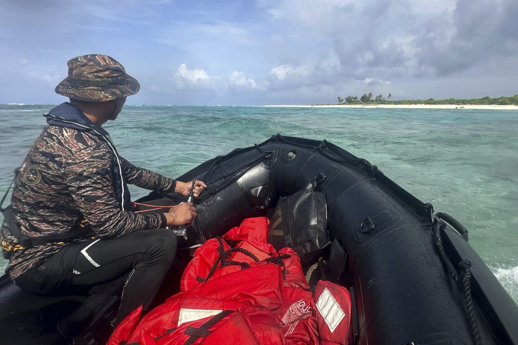 A Philippine Naval Special Operations Group approaches Philippine occupied West York Island. Photo: AP