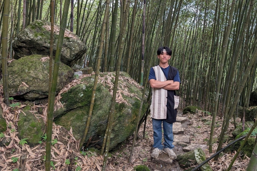 Dai Xinzhe, known by his Truku tribal name Doubi, in a bamboo forest in eastern Taiwan his ancestors once called home. He leads tours that showcase the culture and heritage of the aboriginal tribe. Photo: Lisa Cam