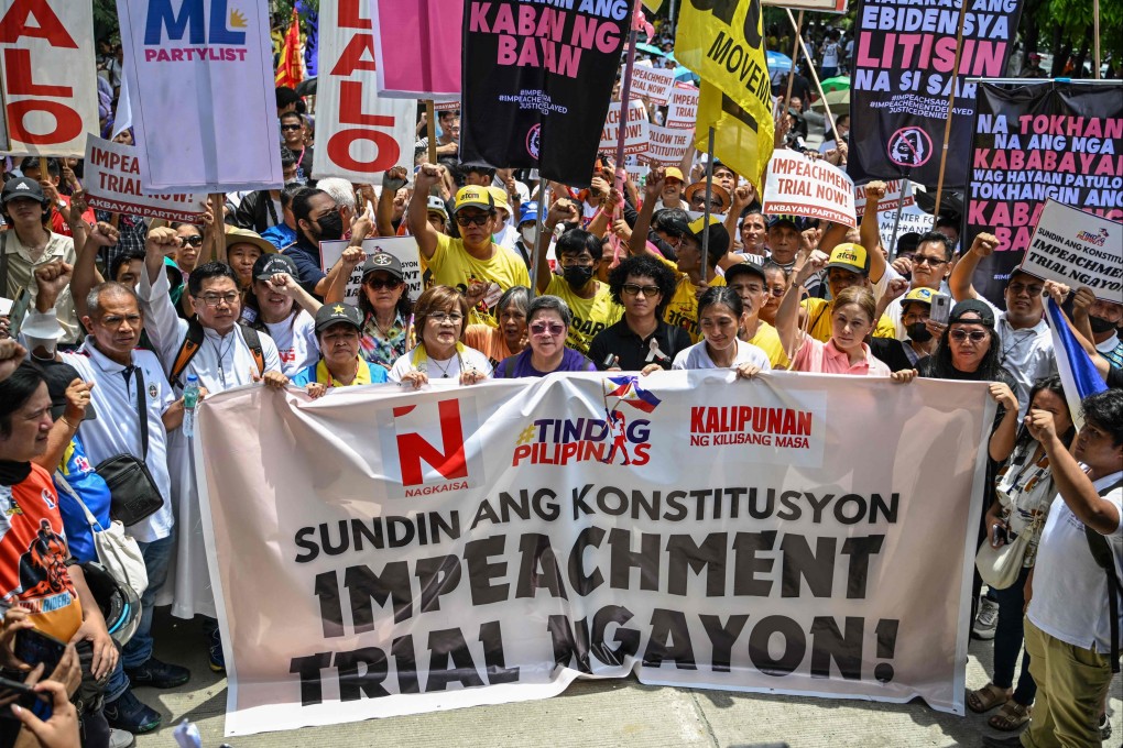 Protesters call for the start of the impeachment trial of Philippine Vice-President Sara Duterte outside the Senate of the Philippines in Pasay, Metro Manila on Monday. Photo: AFP