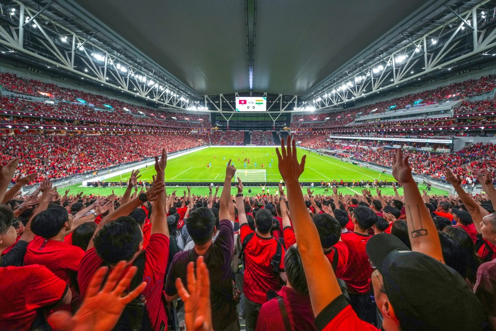 Hong Kong fans cheer for their team at Kai Tak Stadium on Tuesday. Photo: Sam Tsang