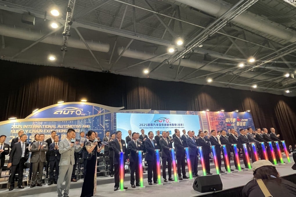 Hong Kong Chief Executive John Lee Ka-chiu (eighth from the left) officiating the opening of the 2025 Hong Kong Automotive Expo at the AsiaWorld Expo on June 12, 2025. Photo: Cao Li