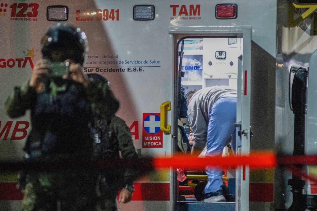 Senator Miguel Uribe receives medical treatment in an ambulance after being shot and wounded in Bogota on June 7. Photo: AFP