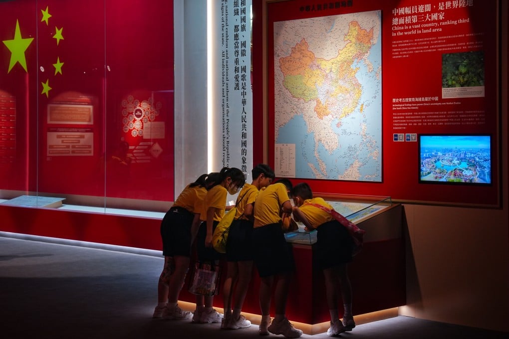 A group of students gather around an installation at the national security exhibition in Hong Kong. Photo: Elson Li