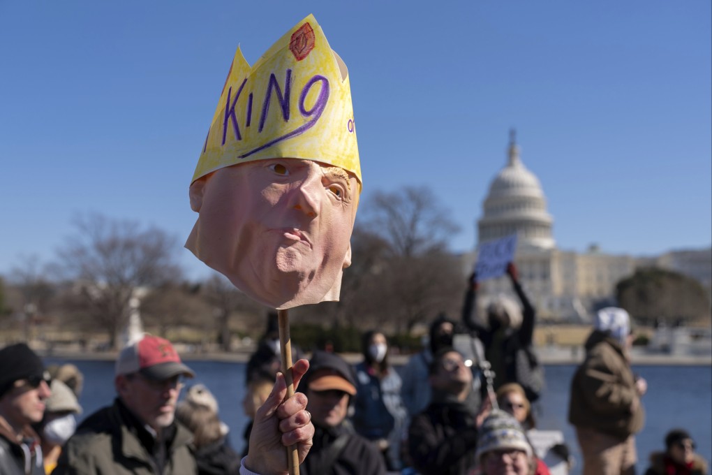 FILE - People take part in the “No Kings Day” protest on Presidents Day in Washington, in support of federal workers and against recent actions by President Donald Trump and Elon Musk, Monday, Feb. 17, 2025, by the Capitol in Washington. (AP Photo/Jose Luis Magana,File)