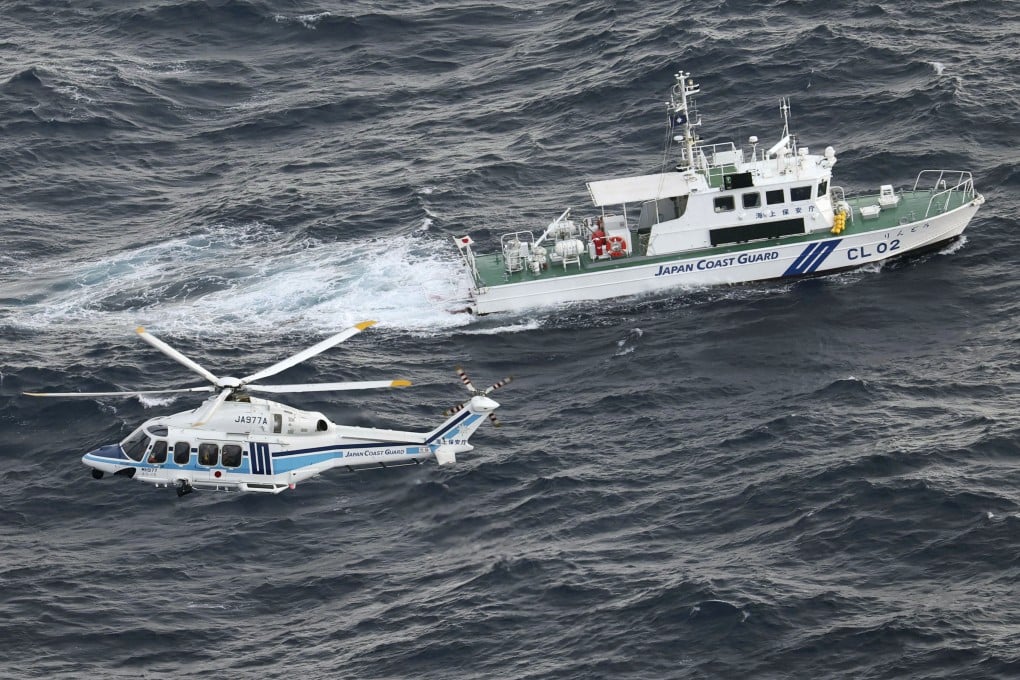 A Japan coastguard patrol ship and helicopter during an operation in southwestern Japan. Photo: Kyodo
