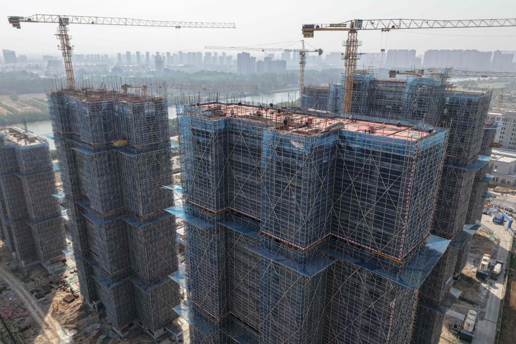 Residential buildings are seen under construction in Fuyang, in eastern China’s Anhui province on May 19, 2025. Photo: AFP