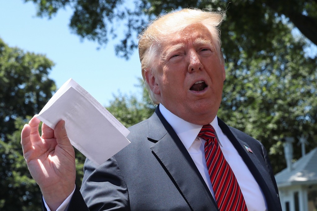US President Donald Trump holds up what he described as a letter from North Korean leader Kim Jong-un outside the White House in June 2019. Photo: Reuters