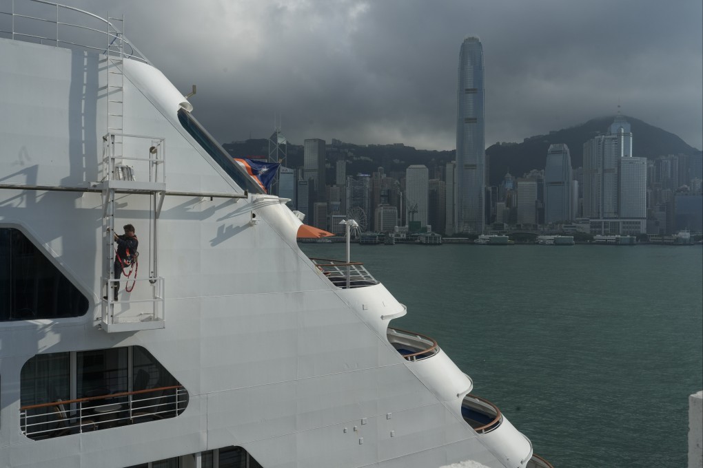 A worker climbs down a ladder on a cruise at Ocean Terminal in Tsim Sha Tsui, on April 20. Photo: Sun Yeung