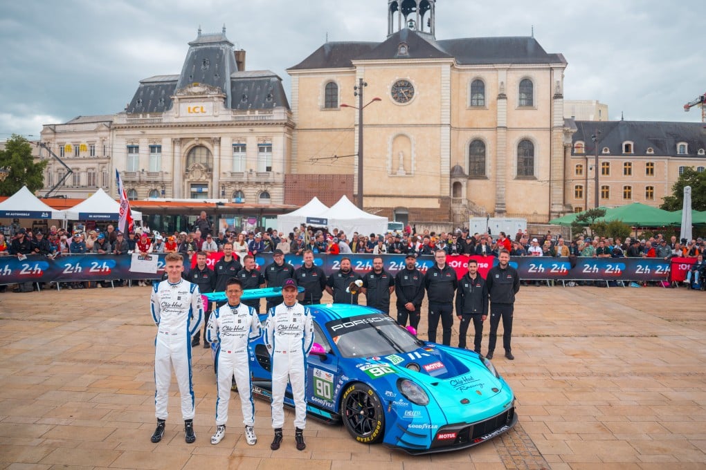 Antares Au (middle) with his team and their Porsche 911 GT3 R. Photo: Jurgen Tapp Photography