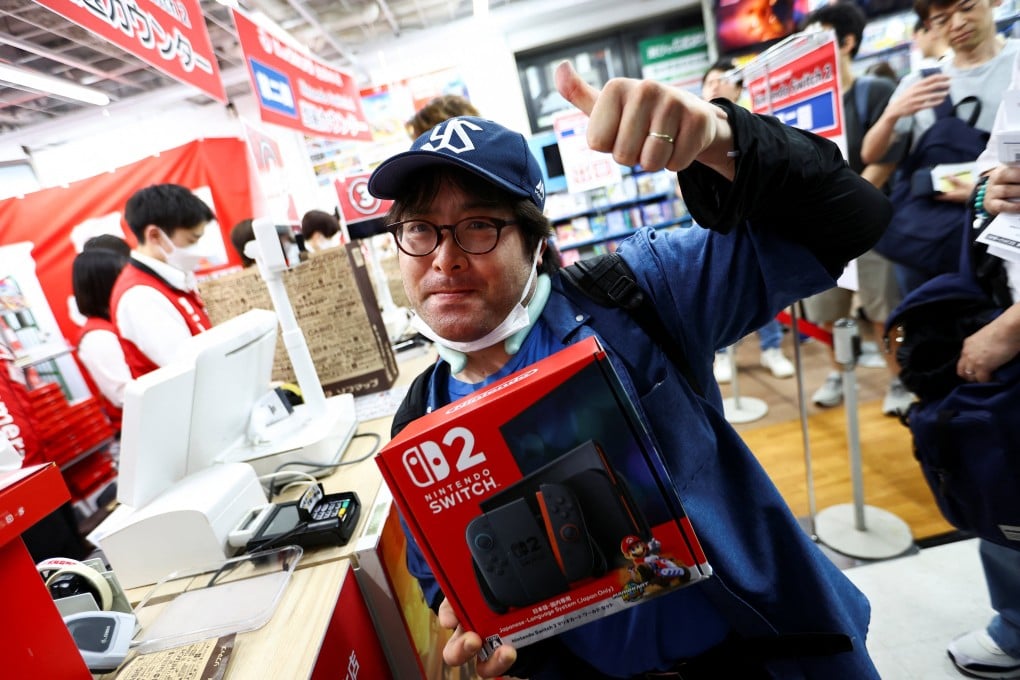 A shopper buys the new Nintendo Switch 2 game console in Tokyo, Japan, on June 5. Photo: Reuters