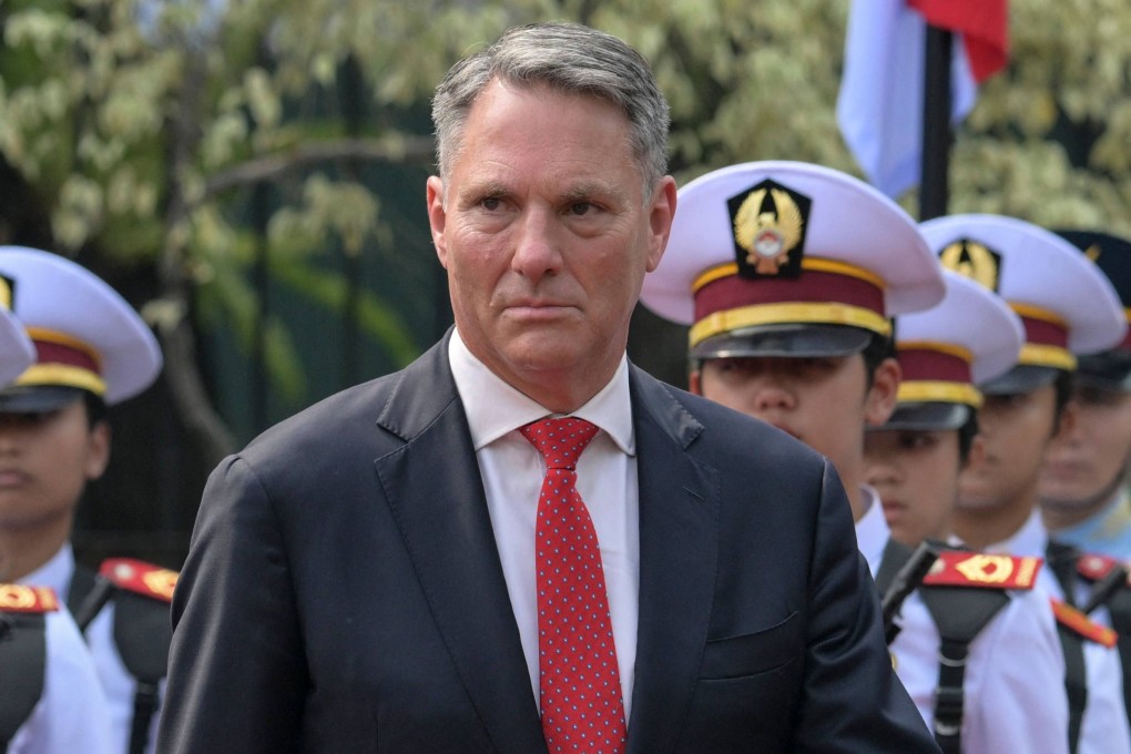 Australia’s Defence Minister Richard Marles inspects honorary guards during a welcoming ceremony in Jakarta on June 5. Photo: AFP