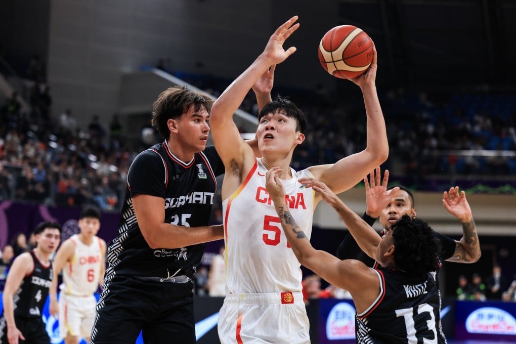 Yang Hansen in possession for China (in white) during an Asia Cup qualifier against Guam in Hefei in November. Photo: VCG via Getty Images