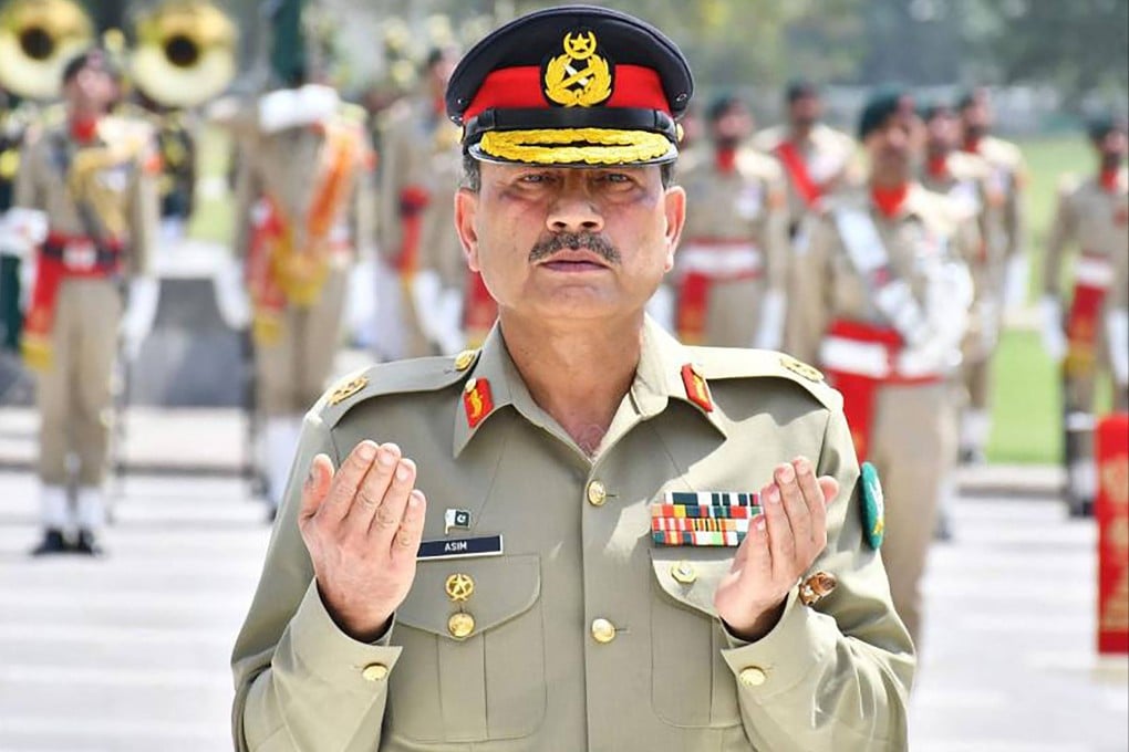 General Asim Munir, Pakistan’s army chief, prays after laying a wreath during a ceremony in Rawalpindi. Photo: AFP/Pakistan’s Inter Services Public Relations