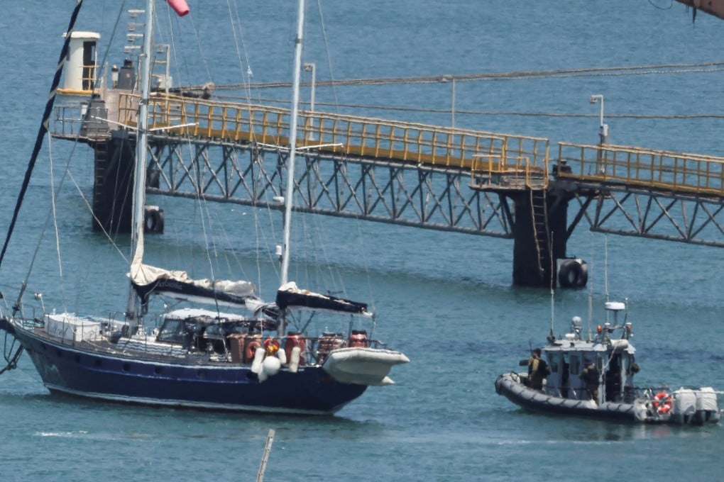 Gaza-bound yacht Madleen is seen docked next to a military boat in the port of Ashdod on Tuesday following a takeover by the Israeli army. Photo: Reuters