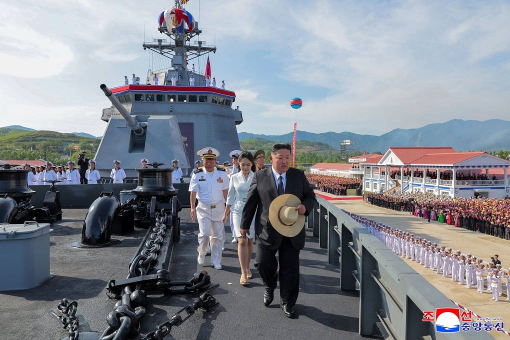 North Korea’s leader Kim Jong-un (centre) and daughter Ju-ae on board the destroyer Kang Kon on Thursday. Photo: KCNA/KNS/AFP