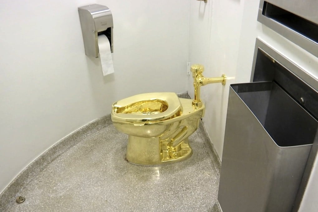 The 18-karat toilet in the restroom of the Guggenheim Museum in New York in 2016. The value of the gold at the time was £2.8 million (US$3.5 million), but it was insured for £4.7 million. Photo: AP