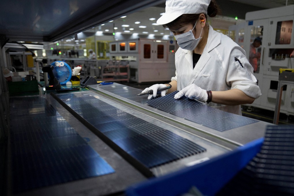 An employee works on a solar panel production line at a factory in Hefei, Anhui province, in May last year. Photo: China Daily via Reuters