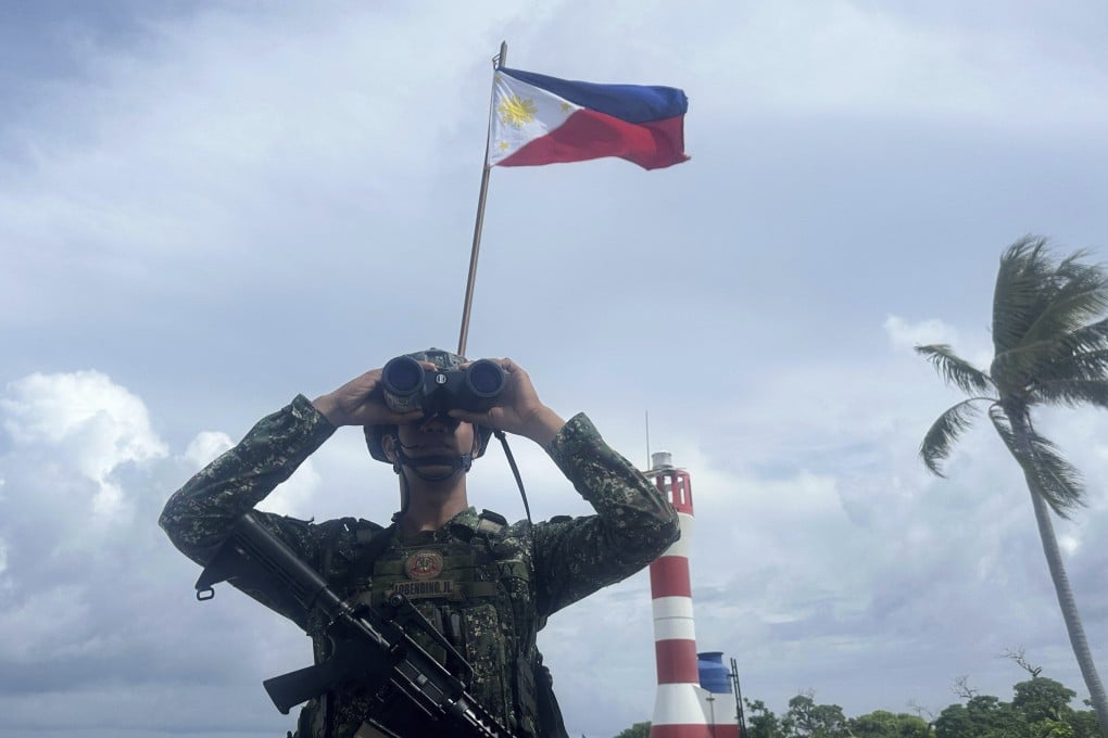 A Philippine marine stands guard at West York Island, locally called Likas Island, one of the Philippine-occupied islands in the South China Sea. Photo: AP