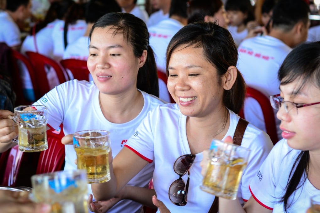 Young women drink beer at local restaurant in Saigon, Vietnam. Photo: Shutterstock