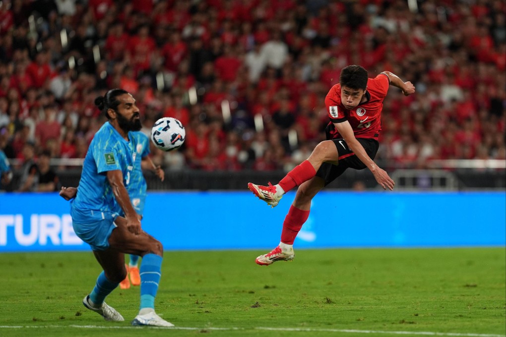 Hong Kong’s Sun Ming-him lets fly from just outside of the box while India captain Sandesh Jhingan tries to move his arm out of the way during the Asian Cup qualifier at Kai Tak Stadium. Photo: Elson Li