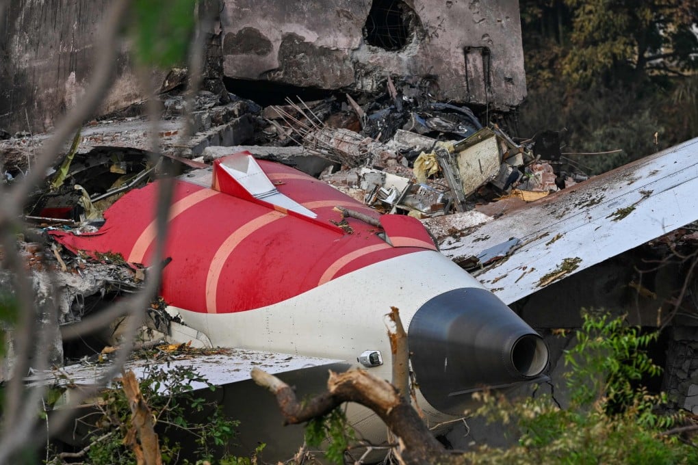 The tail section of the Air India Boeing 787-8 is pictured in a residential area near the airport in Ahmedabad on Saturday, after the aircraft crashed shortly after taking off on Thursday. Photo: AFP