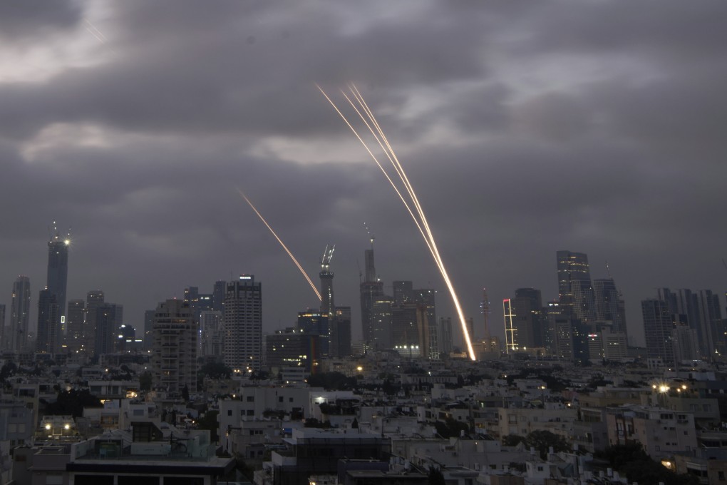 Israel’s Iron Dome air defense system fires to intercept projectiles over Tel Aviv on Saturday. Photo: AP