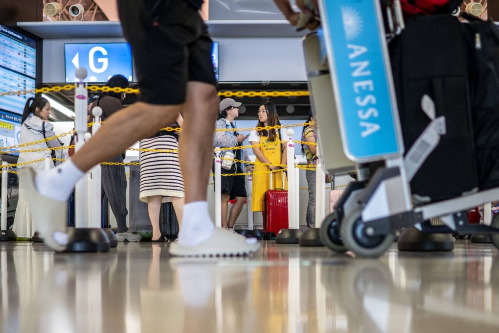 Passengers gather at the departure hall of Kansai International Airport. Photo: AFP