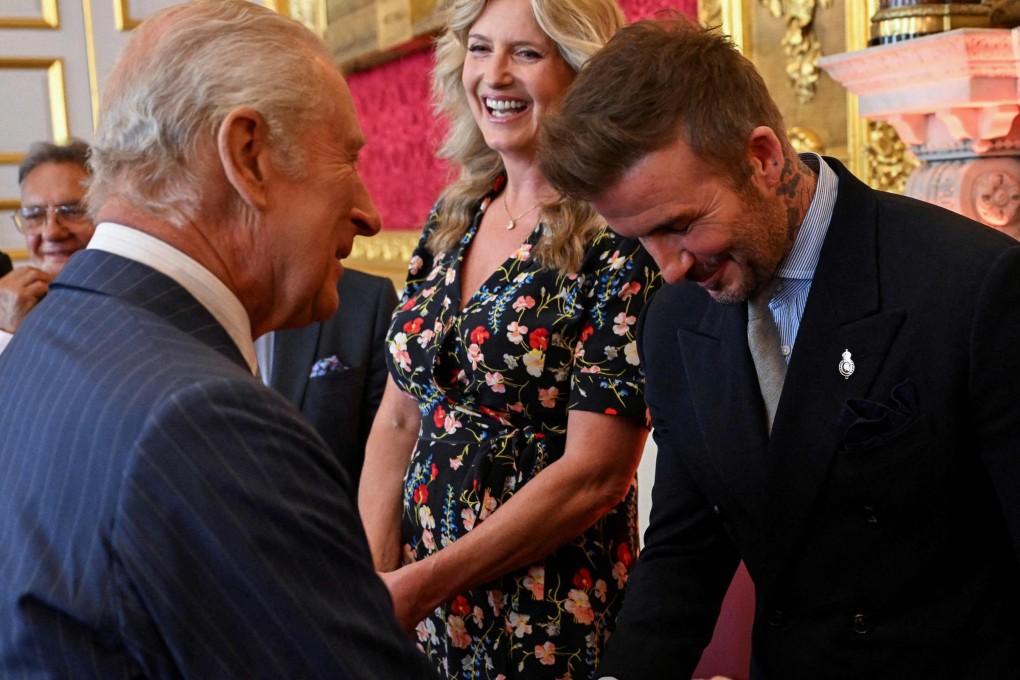David Beckham (right) shakes hands with Britain’s King Charles III (left) during the King’s Foundation Awards ceremony on Thursday. Photo: AFP