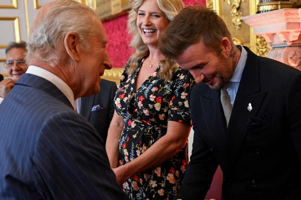 David Beckham (right) shakes hands with Britain’s King Charles III (left) during the King’s Foundation Awards ceremony on Thursday. Photo: AFP