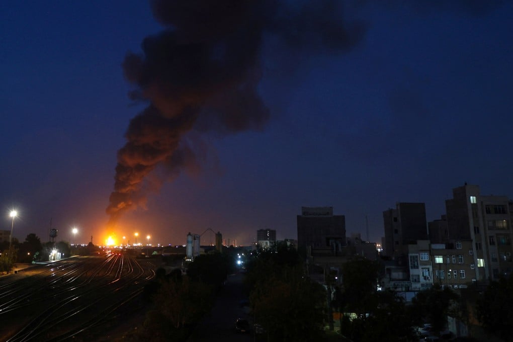 Fire and smoke are seen near Tehran on Sunday following an Israeli strike on the Iranian capital. Photo: via Reuters
