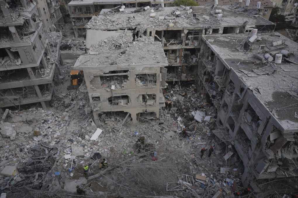 Israeli first responders work in a residential area hit by a missile fired from Iran, near Tel Aviv, on Sunday. Photo: AP