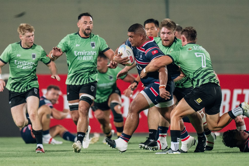 Hong Kong’s Sunia Fameitau breaks through a tackle from the United Arab Emirates’ Brad Janes (right) during his side’s Asia Rugby Championship match at the Sevens Stadium in Dubai. Photo: HKCR