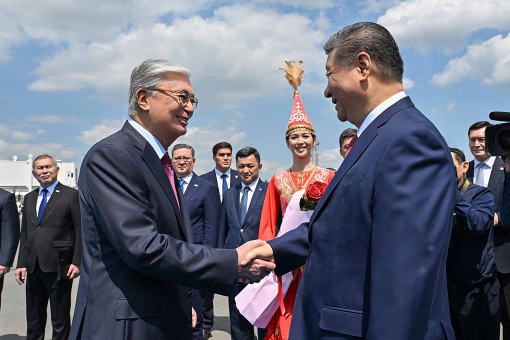 Kazakh President Kassym-Jomart Tokayev (left) greets Chinese President Xi Jinping as he arrives in in Astana for the second China-Central Asia Summit. Photo: AFP
