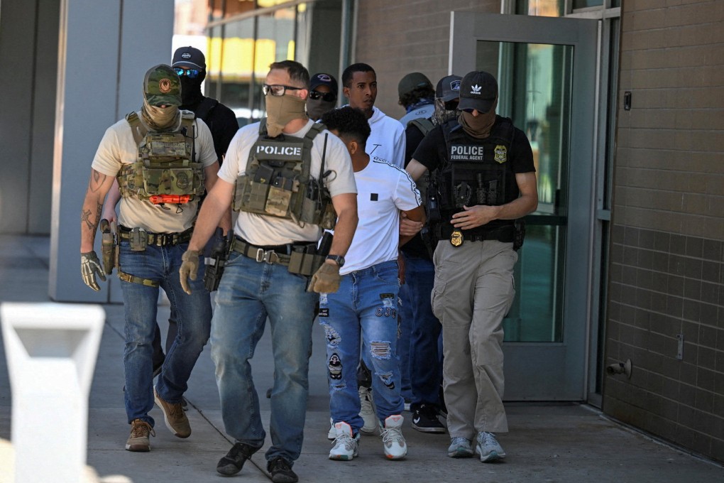 Law enforcement officers take people into custody in Phoenix, Arizona. Photo: Reuters