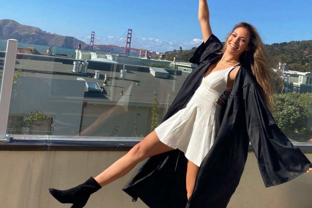 Chinese-American freestyle skiing world champion Eileen Gu wears a white fitted dress beneath her graduation gown for her high school graduation in 2020. Photo: Instagram/eileengu