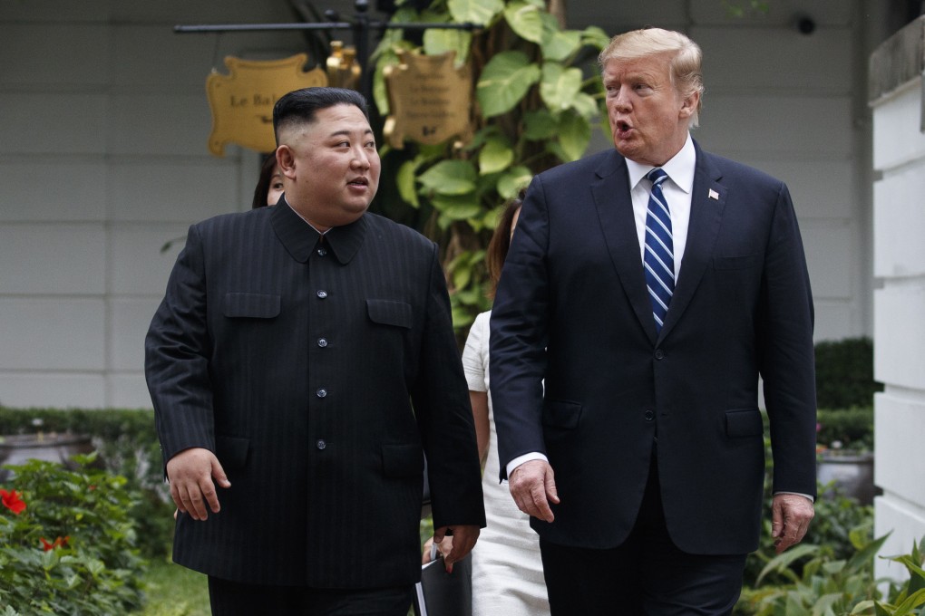 North Korean leader Kim Jong-un and US President Donald Trump take a walk after their meeting in Hanoi in February 2019. Photo: AP