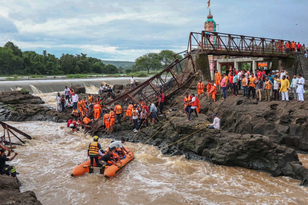 Rescuers work at the site of a bridge collapse over the Indrayani River near Pune, Maharashtra, India, on Sunday. Photo: EPA-EFE