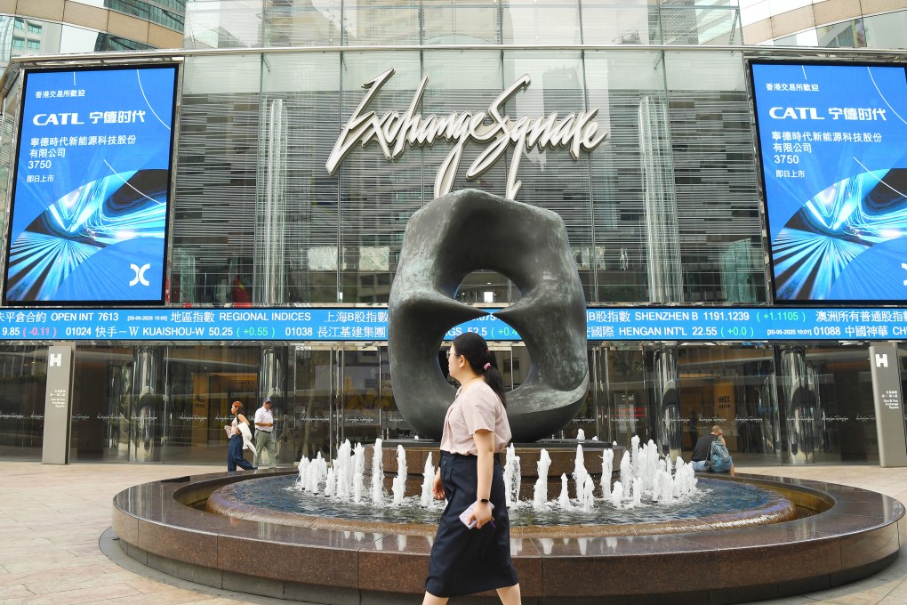 People walk outside Exchange Square, home of the Hong Kong stock exchange, on May 20, 2025. Photo: Xinhua