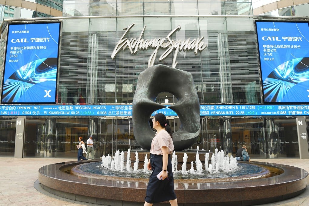 People walk outside Exchange Square, home of the Hong Kong stock exchange, on May 20, 2025. Photo: Xinhua