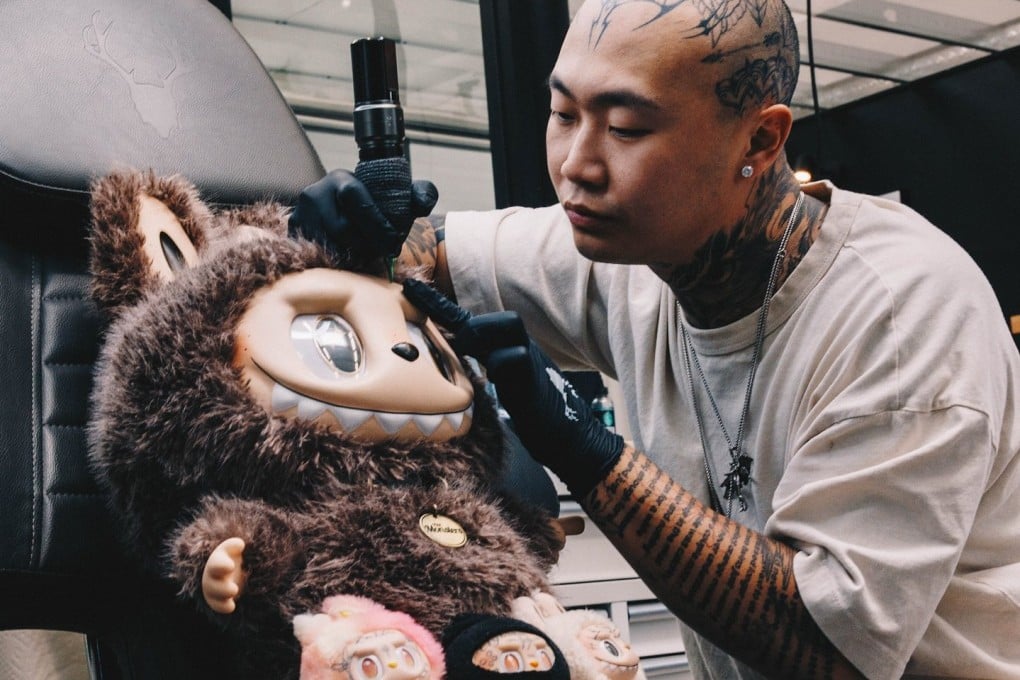 Tattoo artist Hunter Chao works on a “Tabubu”, his line of tattooed Labubu toys that typically sell for between US$170 and US$200. Photo: Hunter Chao/Bryam Heredia