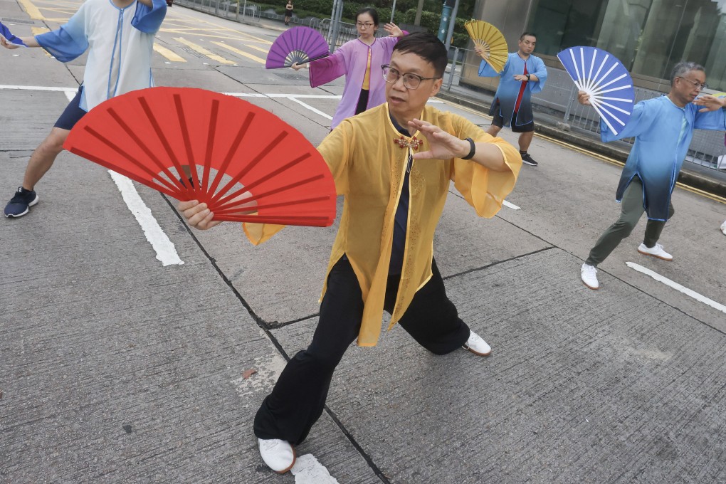 When Hongkonger Alfred Yu (centre) retired, he took up a number of activities, including teaching tai chi with fans. He says retirement allowed him to explore new possibilities, develop different skills and share them freely with others. Photo: Jonathan Wong
