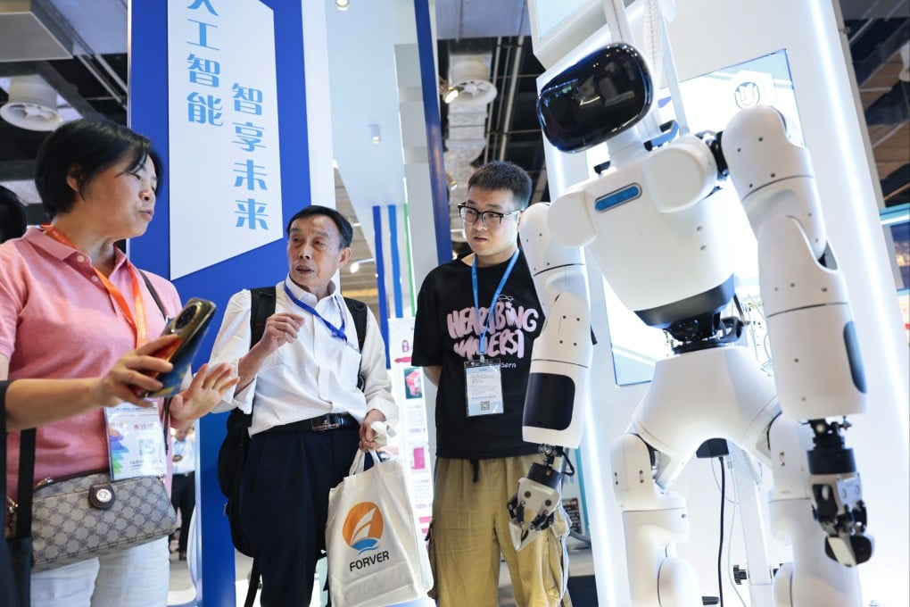 Visitors talk near a humanoid robot displayed during the 11th China (Shanghai) International Technology Fair (CSITF) in China’s Shanghai, on June 11, 2025. Photo: Xinhua