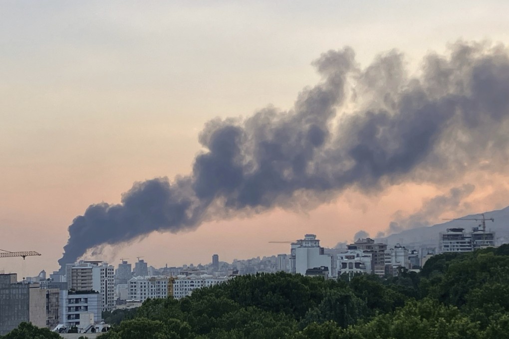 Smoke rises from the building of Iran’s state-run television after an Israeli strike in Tehran, Iran, on Monday. Photo: AP