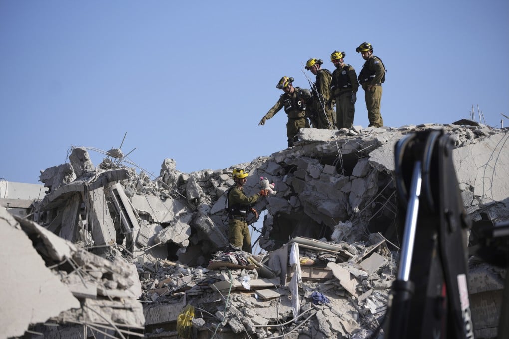 Israeli security forces inspect destroyed houses that were struck by a missile fired from Iran on Saturday. Flaring tensions between the two adversaries have put China’s self-proclaimed neutrality under the spotlight again. Photo: AP