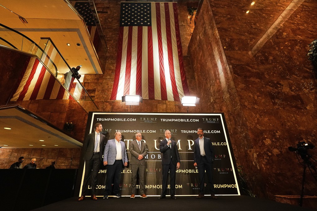 From left, Eric Trump, Don Hendrickson, Eric Thomas, Patrick O’Brien and Donald Trump Jnr take part in the announcement of Trump Mobile, in New York’s Trump Tower on Monday. Photo: AP