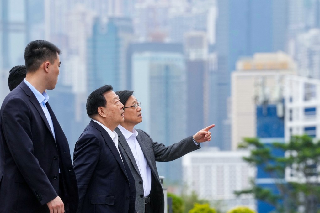 City leader John Lee (right) has confirmed that Xia Baolong (second from right) will visit Hong Kong for five days, beginning on Wednesday. Photo: Elson Li